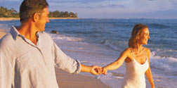 A couple walking along the beach