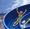 Women riding a cruise ship waterslide