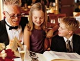 Grandfather and grandkids enjoying a cruise